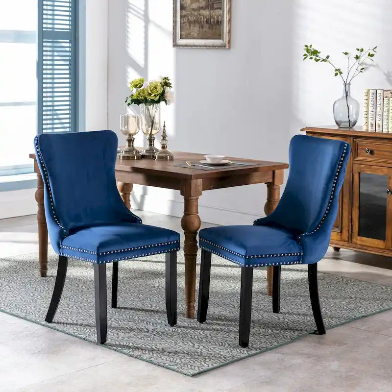 Chaise de salle à manger à oreilles en velours avec clous décoratifs et surpiqûres en losange bleues
