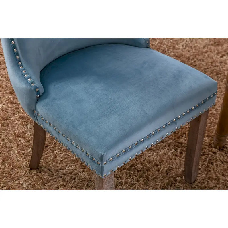 Chaise de salle à manger à oreilles en velours avec clous décoratifs et surpiqûres en losange bleues