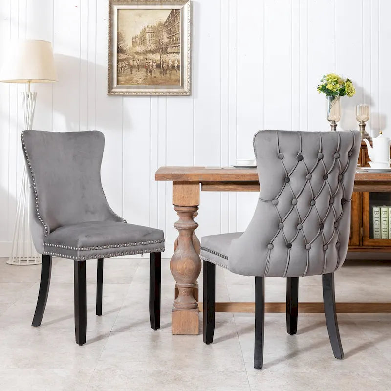Chaise de salle à manger à oreilles en velours avec clous décoratifs et surpiqûres en losange bleues