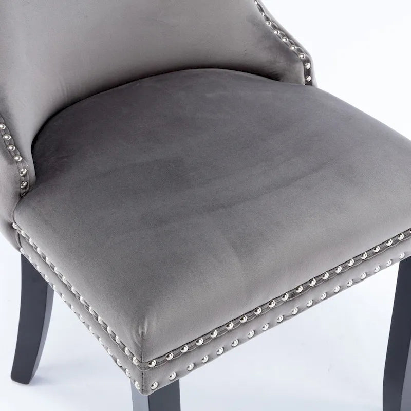 Chaise de salle à manger à oreilles en velours avec clous décoratifs et surpiqûres en losange bleues