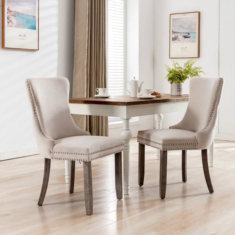 Chaise de salle à manger à oreilles en velours avec clous décoratifs et surpiqûres en losange bleues