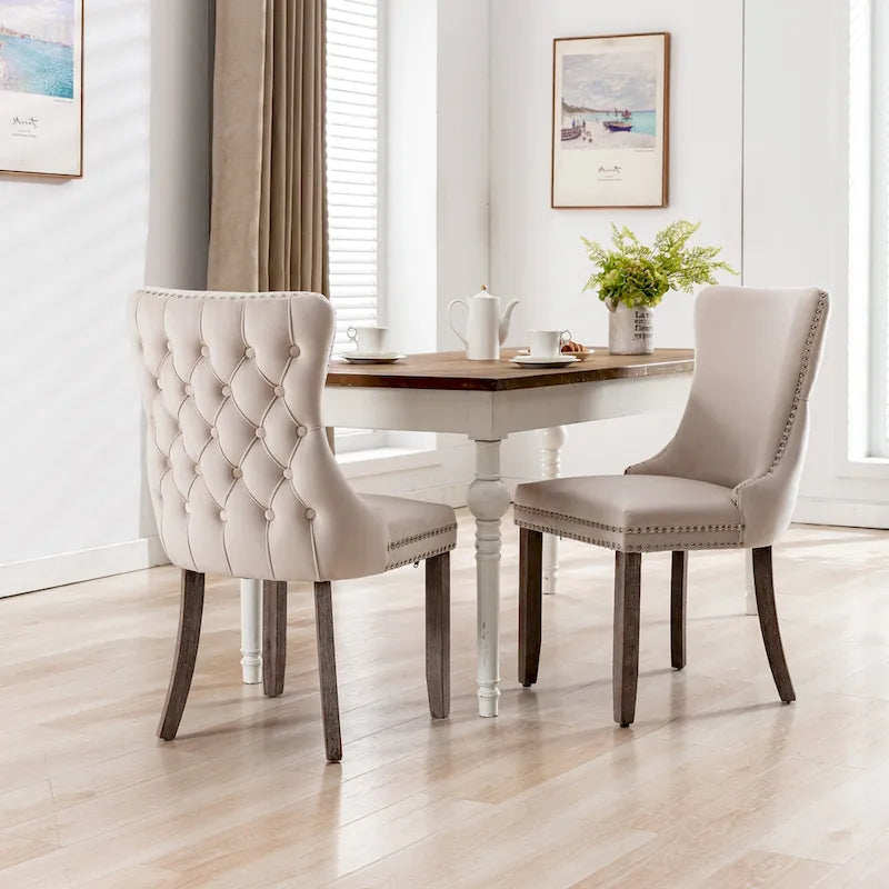 Chaise de salle à manger à oreilles en velours avec clous décoratifs et surpiqûres en losange bleues