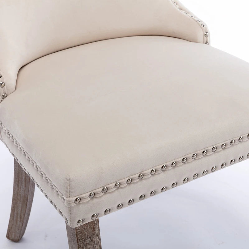 Chaise de salle à manger à oreilles en velours avec clous décoratifs et surpiqûres en losange bleues