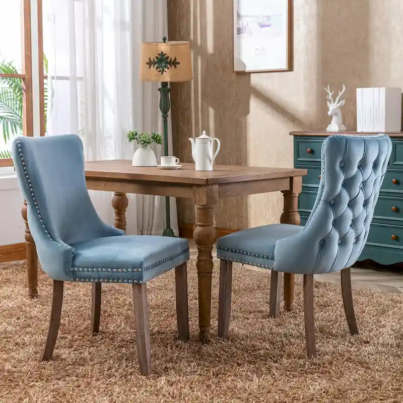 Chaise de salle à manger à oreilles en velours avec clous décoratifs et surpiqûres en losange bleues