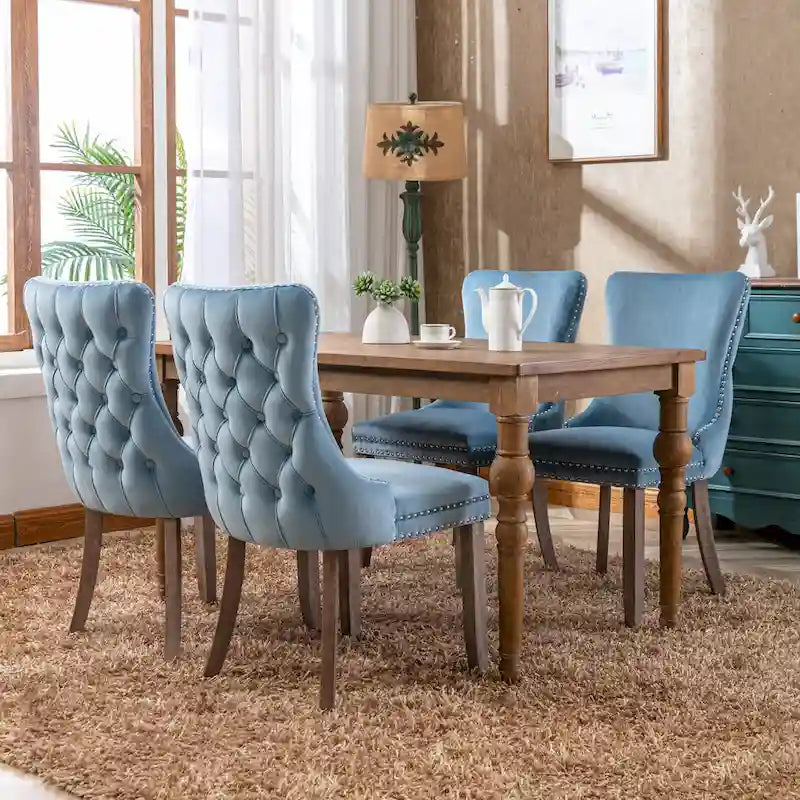 Chaise de salle à manger à oreilles en velours avec clous décoratifs et surpiqûres en losange bleues