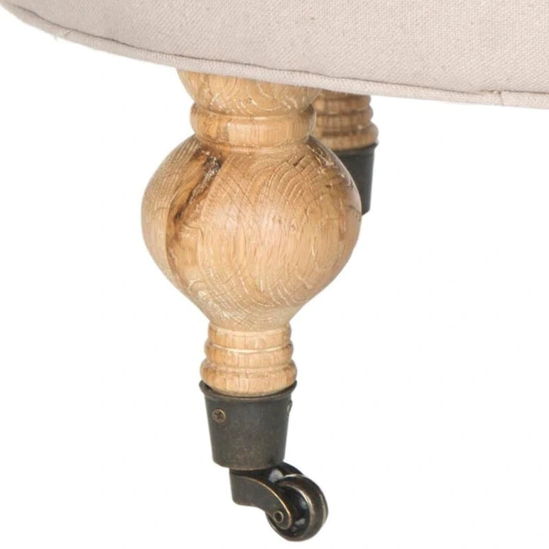 Pouf rond en lin capitonné avec pieds en bois tournés et roulettes, coloris champignon