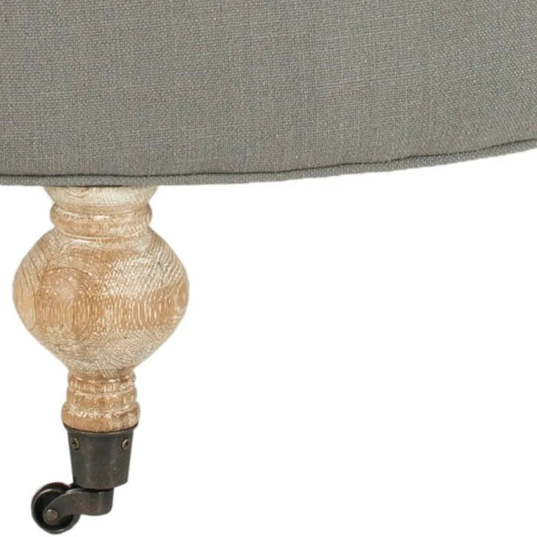 Pouf rond en lin capitonné avec pieds en bois tournés et roulettes, coloris champignon
