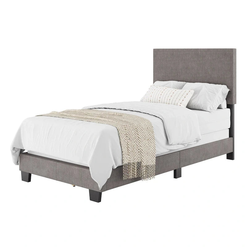 Lit plateforme capitonné jumeau avec tête de lit en tissu rembourré, pied de lit bas et pieds en bois coniques bleus