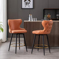 Tabouret de bar pivotant à hauteur de comptoir avec siège en similicuir à dossier capitonné et garniture de clous dorés Orange